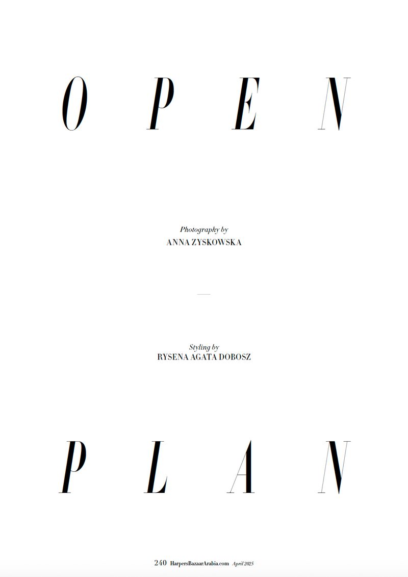 Fashion magazine cover featuring typography, 'Open Plan,' on a white background with photographer and stylist credits in simple black font.