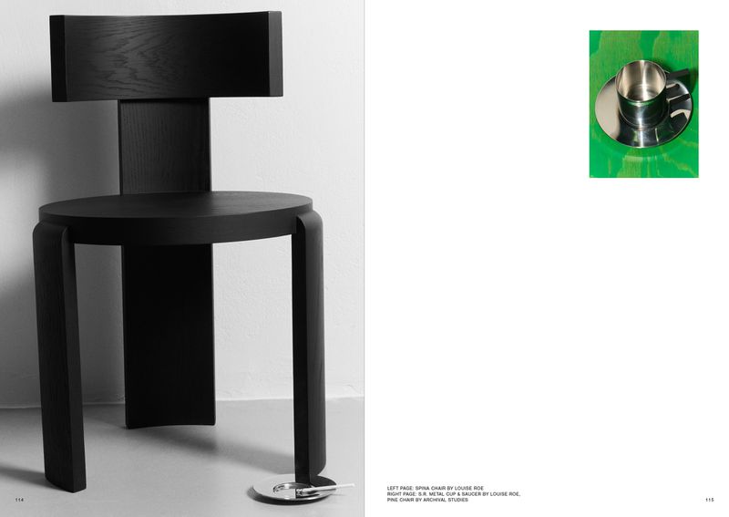 Black round seat chair with a modern design featured on a magazine page, highlighting its unique form and architectural presence.