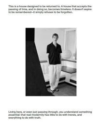 Man wearing a black short sleeve shirt and white trousers standing indoors for Massimo Dutti project Casa Rovira.