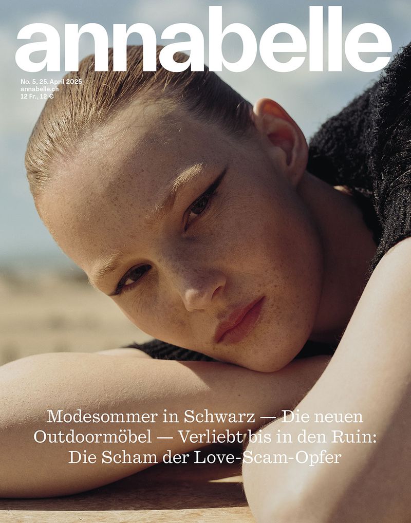Magazine cover featuring a fair-skinned young woman with dark eyeliner and pink lipstick, soft natural lighting, outdoor backdrop.