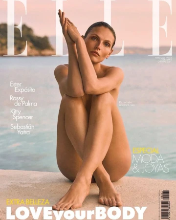 Elle magazine cover featuring a nude adult female model seated with arms raised in front of a blurred outdoor background.