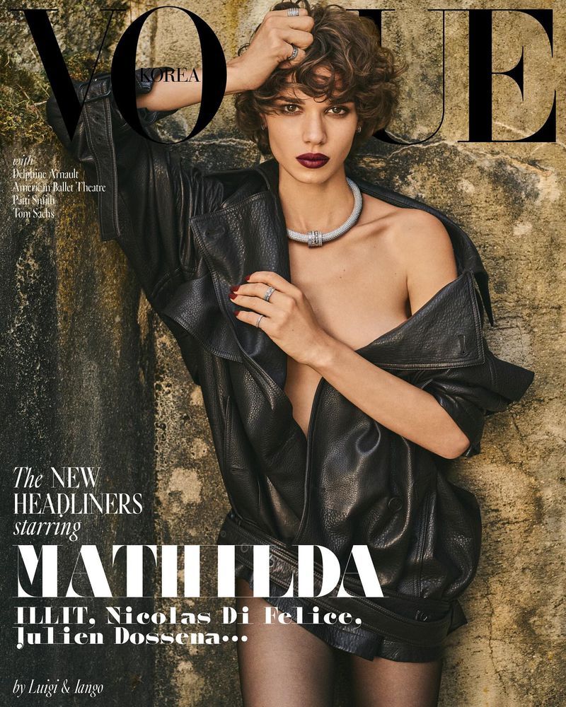 Vogue Korea cover featuring a stylish adult female model in a black leather jacket, statement necklace, and dark lipstick against a textured background.