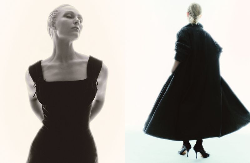 Annasophia Robb in a black dress and coat against a bright white background for Behind the Blinds.