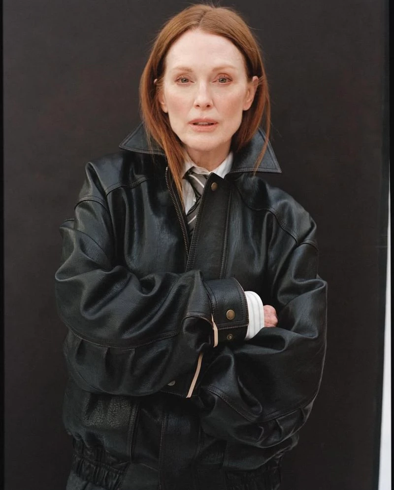 Julianne Moore in a black leather jacket and tie against a dark background for Neptune Papers