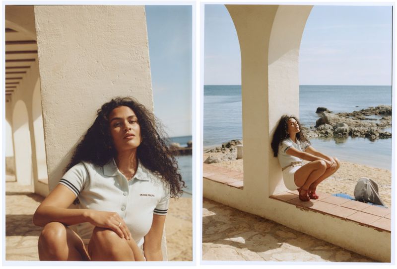Two-panel fashion shot: woman in light blue outfit on a beach. Ocean backdrop with rocky landscape and arches framing each scene.