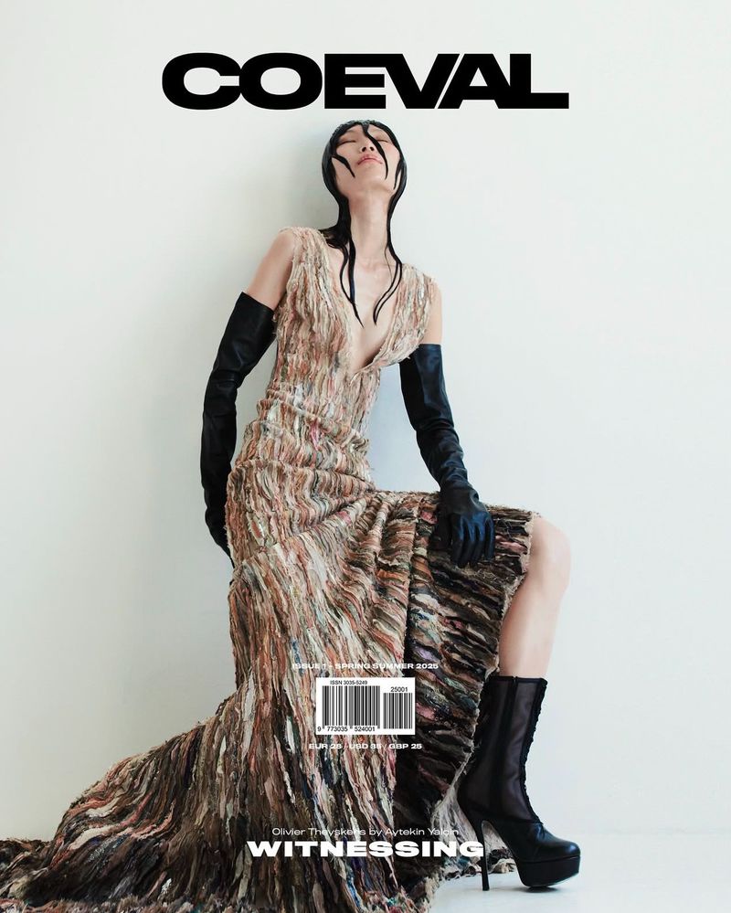 Magazine cover featuring an Asian woman in a flowing dress, long gloves and platform boots against a stark white background, 'COEVAL' text.
