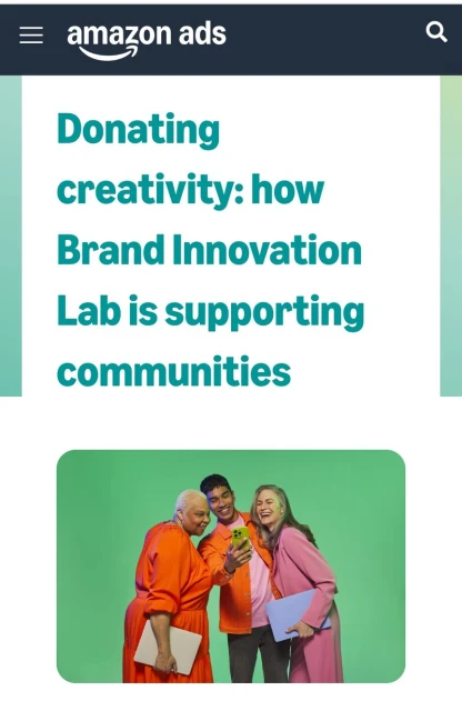 Three people, including an older adult, smiling together while looking at a cell phone against a green background in an Amazon Ad.