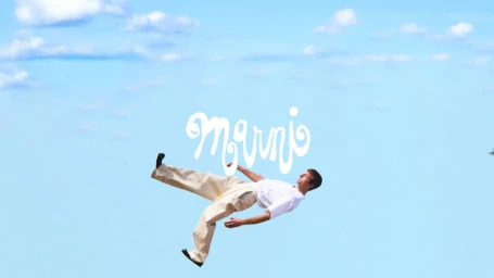 Man falling through a bright blue sky with white clouds for Marni SS25 Vol 2 campaign