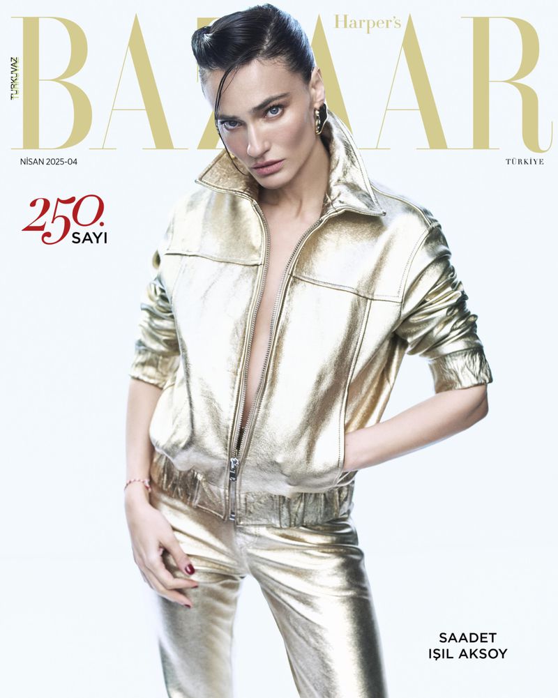 Saadet Isil Aksoy poses in a gold metallic jacket and pants for Harper's Bazaar Turkey cover, with a white background and magazine text overlay.