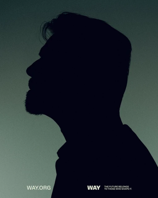 Silhouette of an adult man's head and shoulders in profile against a muted green backdrop, conveying a sense of contemplation.