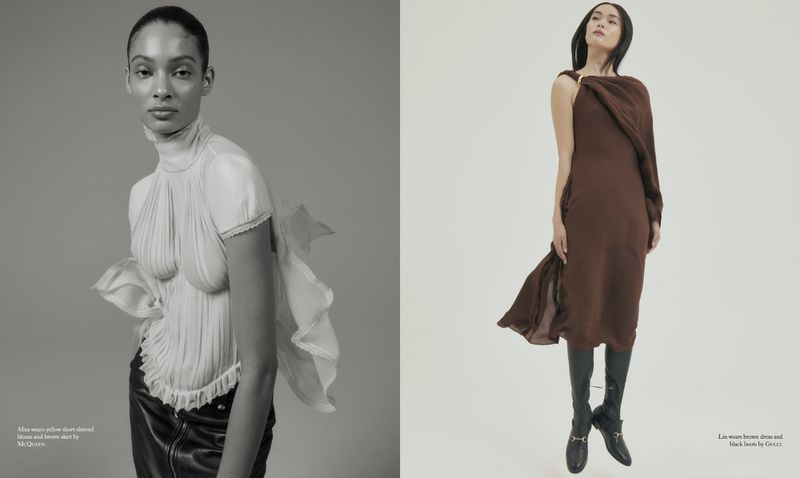 Fashion editorial shot of two young adult women modelling designer outfits. One in a cream blouse with a black skirt and the other in a brown dress and black boots.