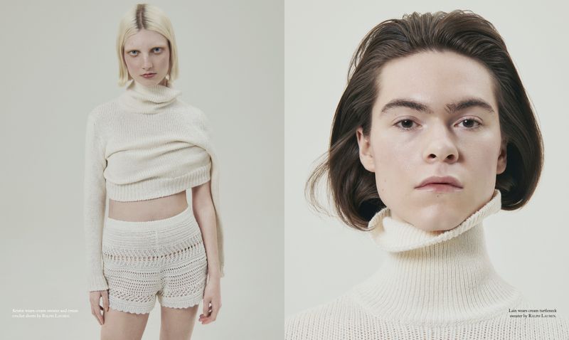 Two young adults in a studio shot, one blonde in knit shorts and crop sweater, the other with brown hair, wearing a turtleneck sweater.