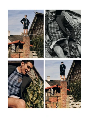 Fashion editorial quadrilayout: young man in blazer and shorts poses atop brick chimney against houses and sky, smiling, stylish.