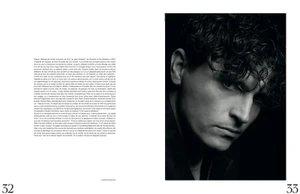 Monochrome close-up portrait of actor Raphael Quenard with dark curly hair for French Magazine, photographed by Thierry LeGoues.