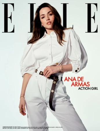 Elle magazine cover featuring Ana de Armas in a white outfit with a black belt, posing against a light background, in a studio shot.
