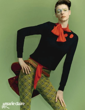 A fashion shot features a stylish woman in green plaid pants, a black sweater with red accents, a brown belt, and a veiled headpiece.