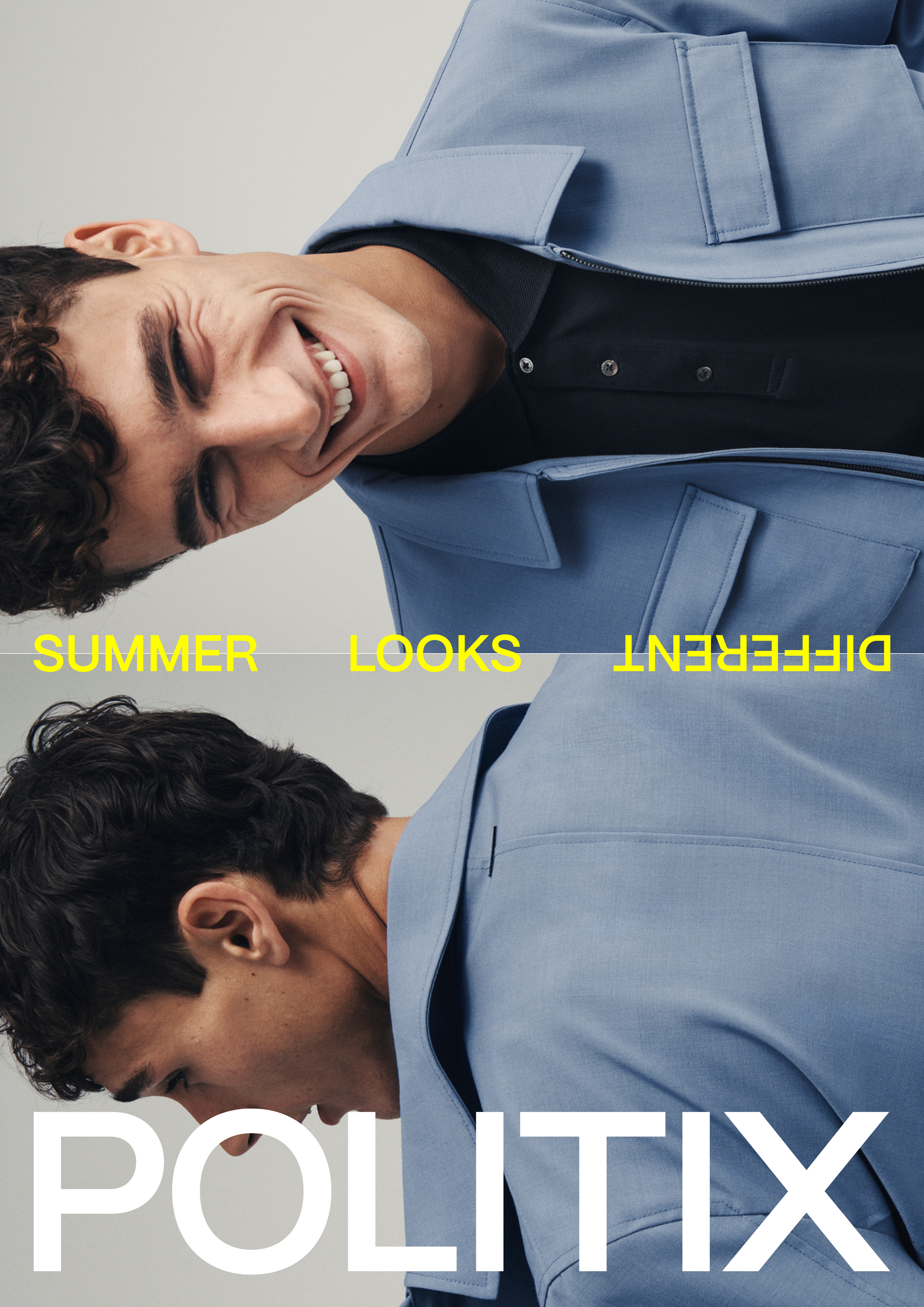 Fashion portrait of a smiling man wearing a blue jacket and a black polo shirt, showcasing summer looks by Politix, against a light background.