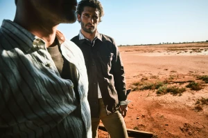 Two men standing in an arid desert landscape for a Country Road campaign, photographed by Simon Lekias.