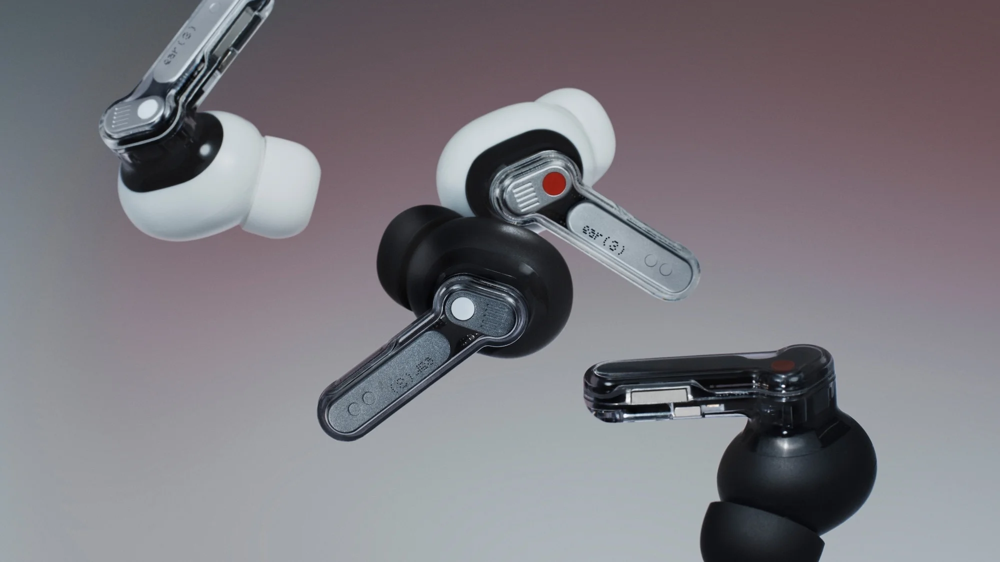 A close-up studio shot features multiple Nothing Ear (3) wireless earbuds, with black and white color options, set against a gradient backdrop.