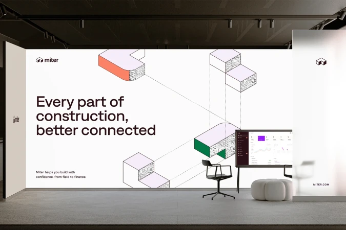 Modern architectural marketing display featuring Miter brand, geometric graphics, screen with data, and sleek chair in a minimalist setting.