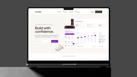 Laptop displaying website interface with light background, bold text, and dashboard elements for Miter brand identity project.