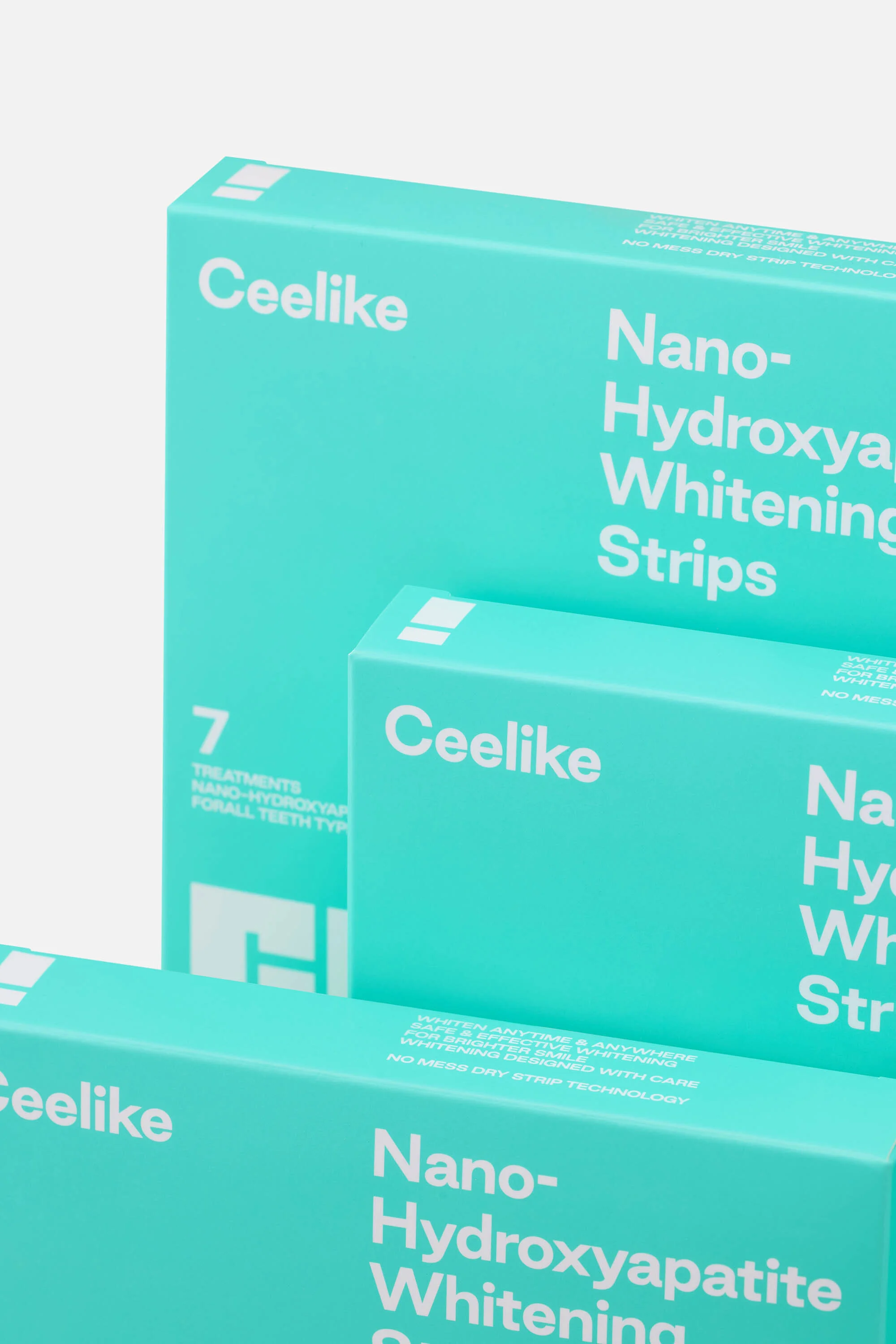 Three packages of Ceelike nano-hydroxyapatite teeth-whitening strips are stacked against a white background in a studio setting.