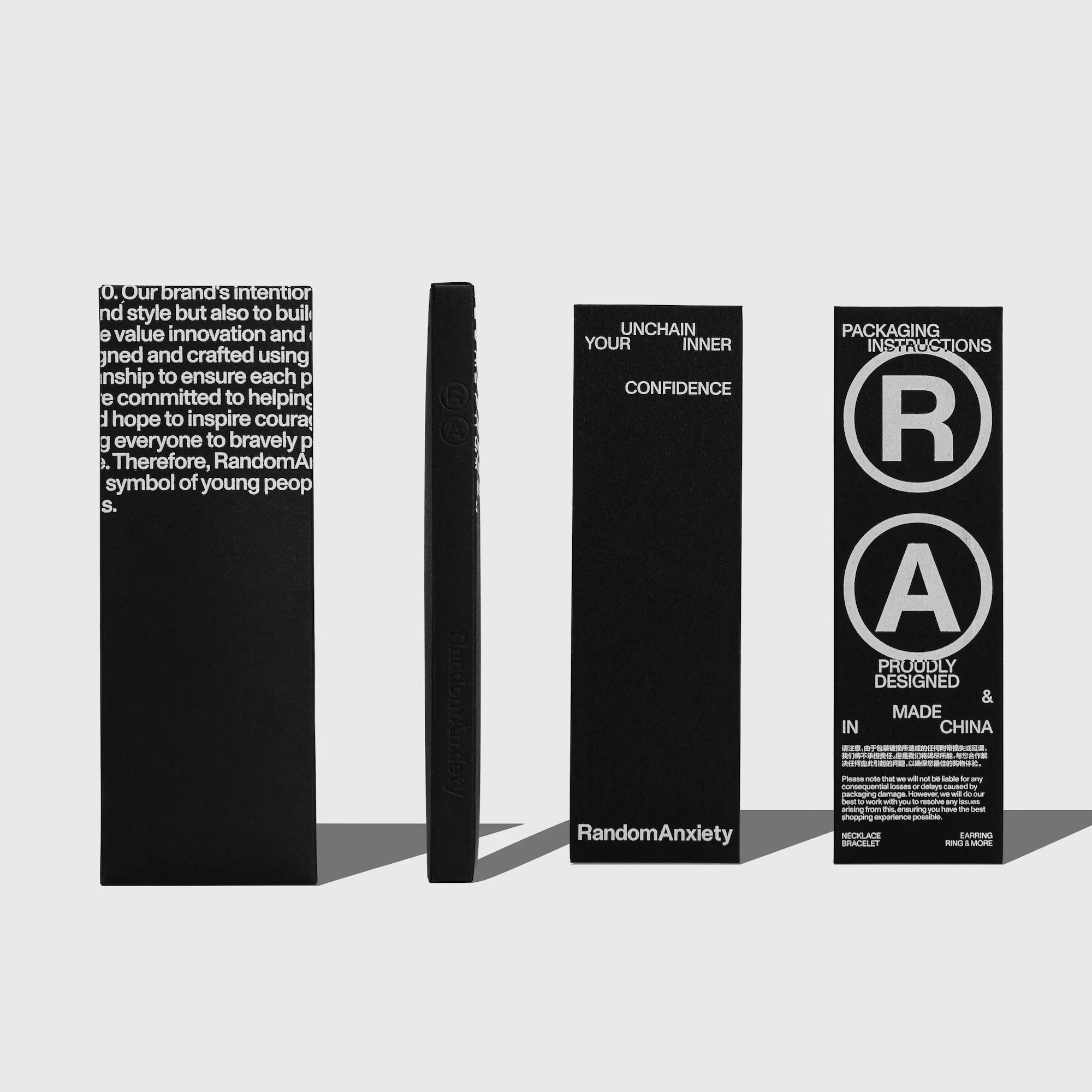 Black product packaging featuring text and logos against a neutral background, showcasing the brand RandomAnxiety's design and messaging.