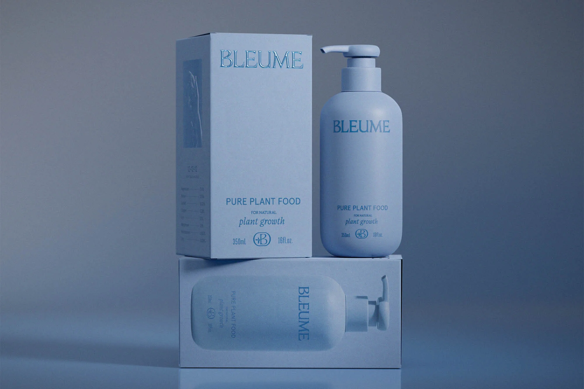 Three light blue BLEUME brand plant food containers arranged on a reflective surface, with product details and brand name visible.
