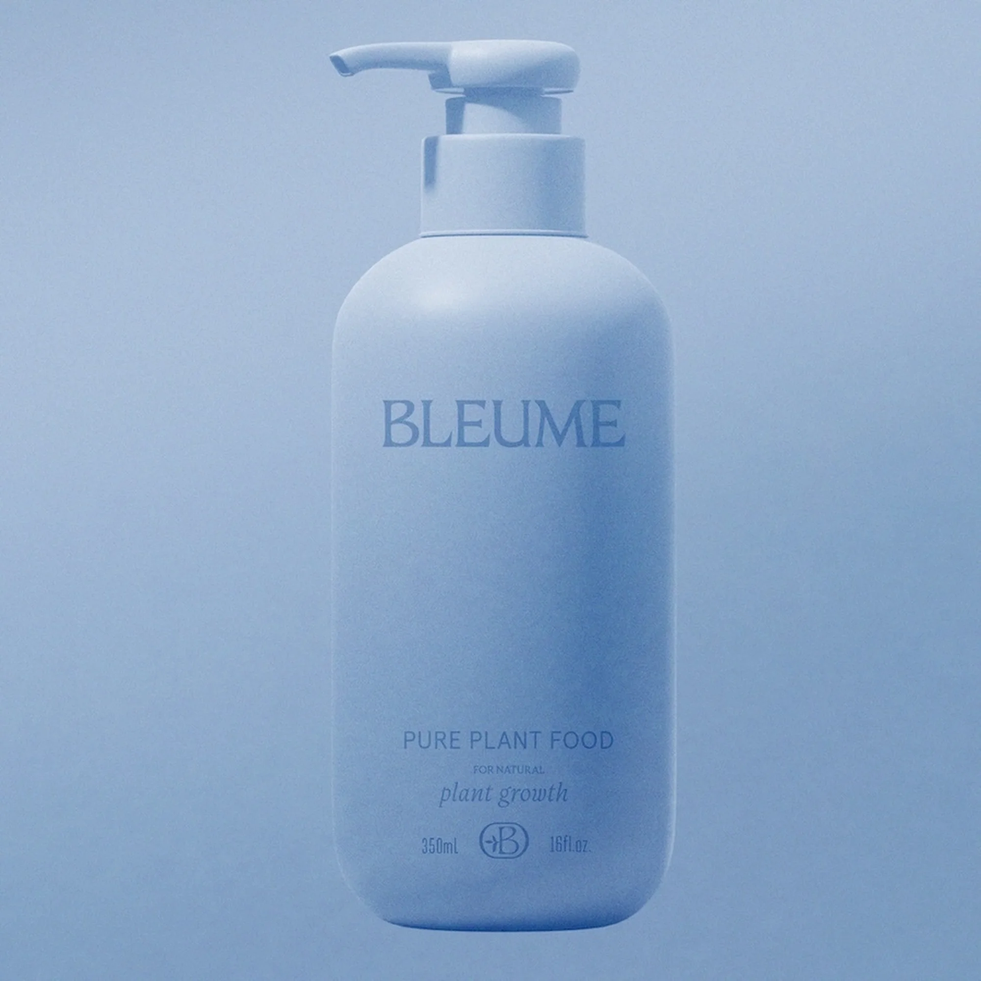 Minimalist product shot of a light blue Bleume bottle with pump dispenser on a matching background. Features simple typography.