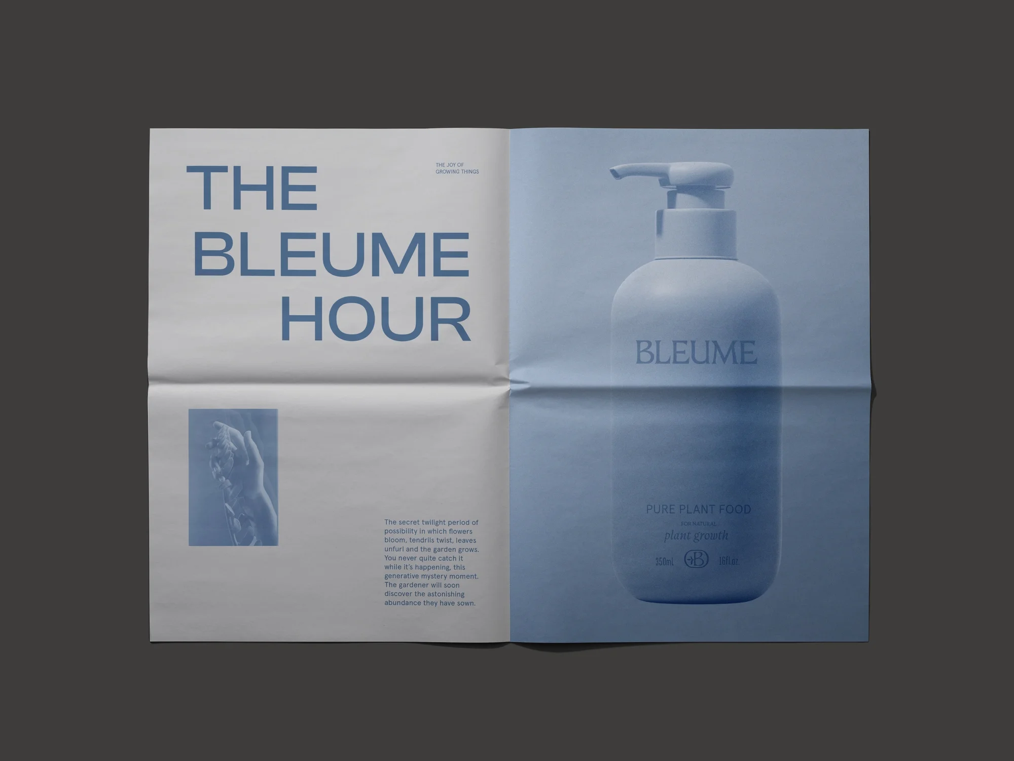 Bleume brand promotion in blue tones: cosmetic bottle and open magazine layout with product details, typography, and hand image.