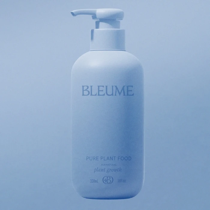 Blue pump bottle of Bleume pure plant food against a matching blue background