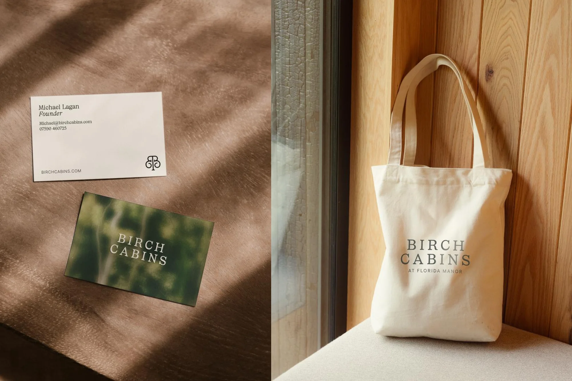 Close-up studio shot of business cards with company logo and contact details next to a tote bag in front of a wooden panel.