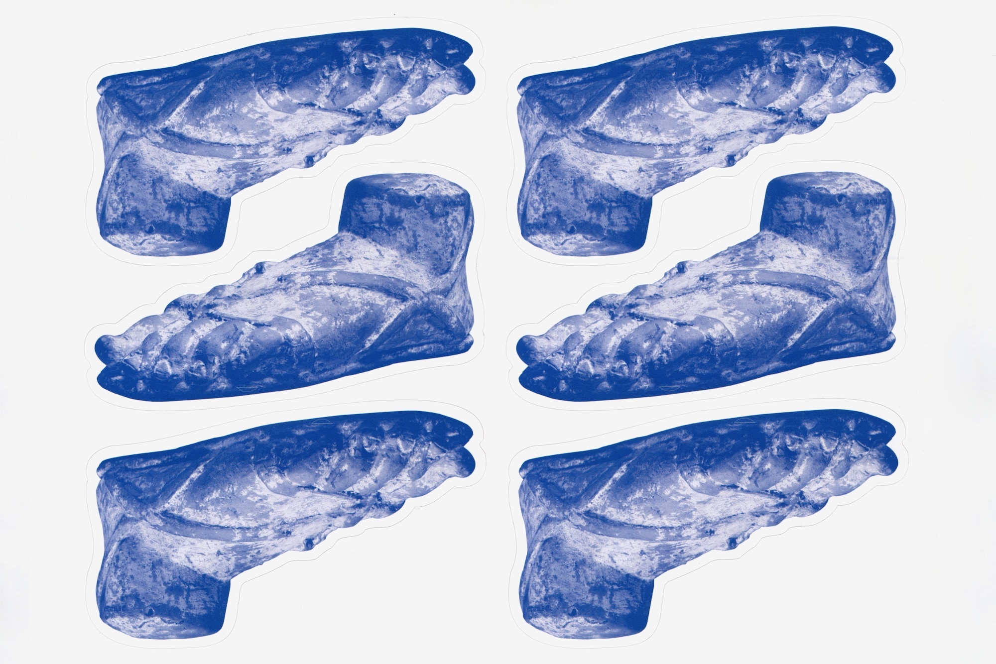 A pattern of blue-toned sculptural feet, arranged on a white background, creates a unique visual rhythm and aesthetic.