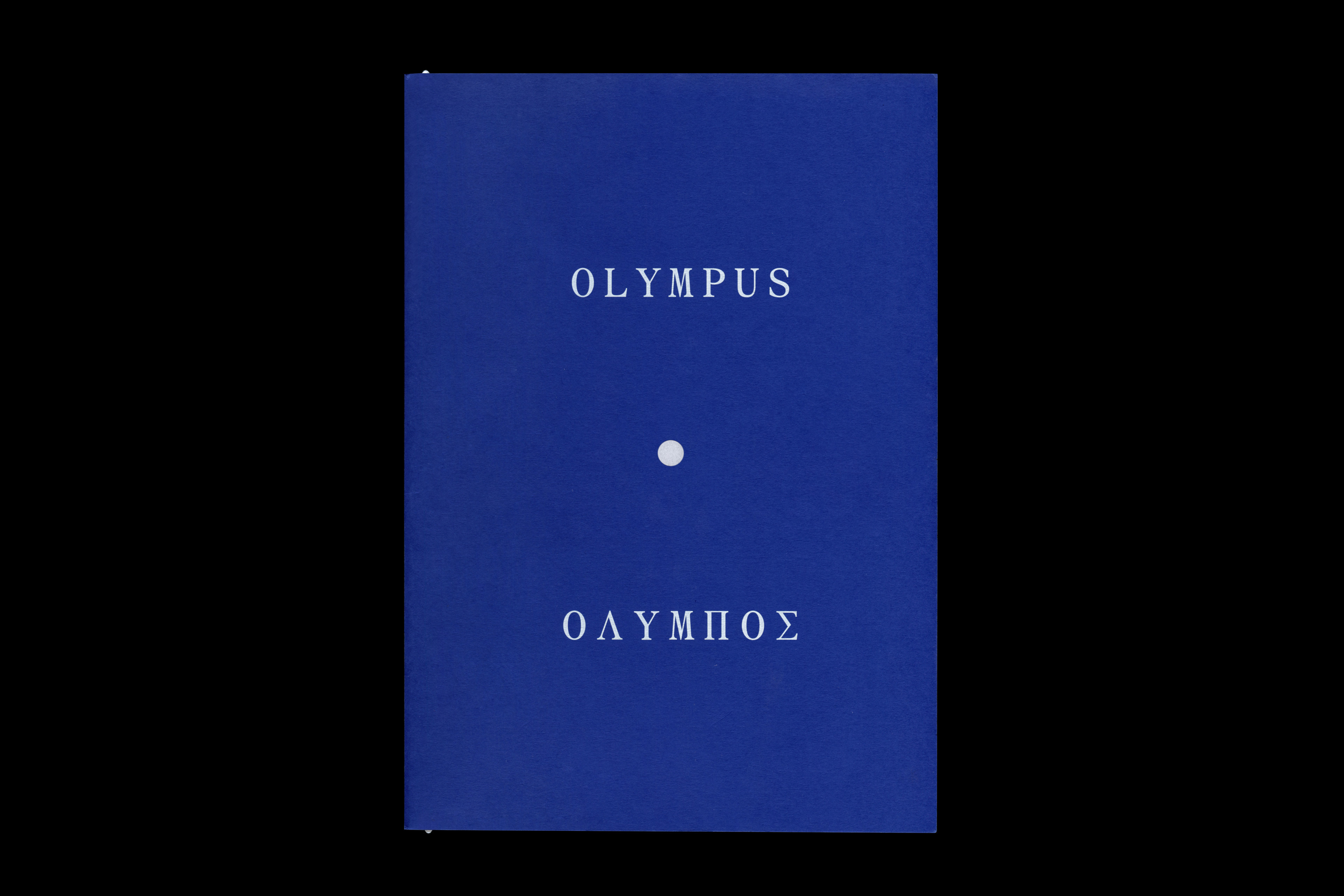 Blue book cover featuring the word 'Olympus' in white, above a white dot, and the word 'OLYMPOS' below, centered on a black background.