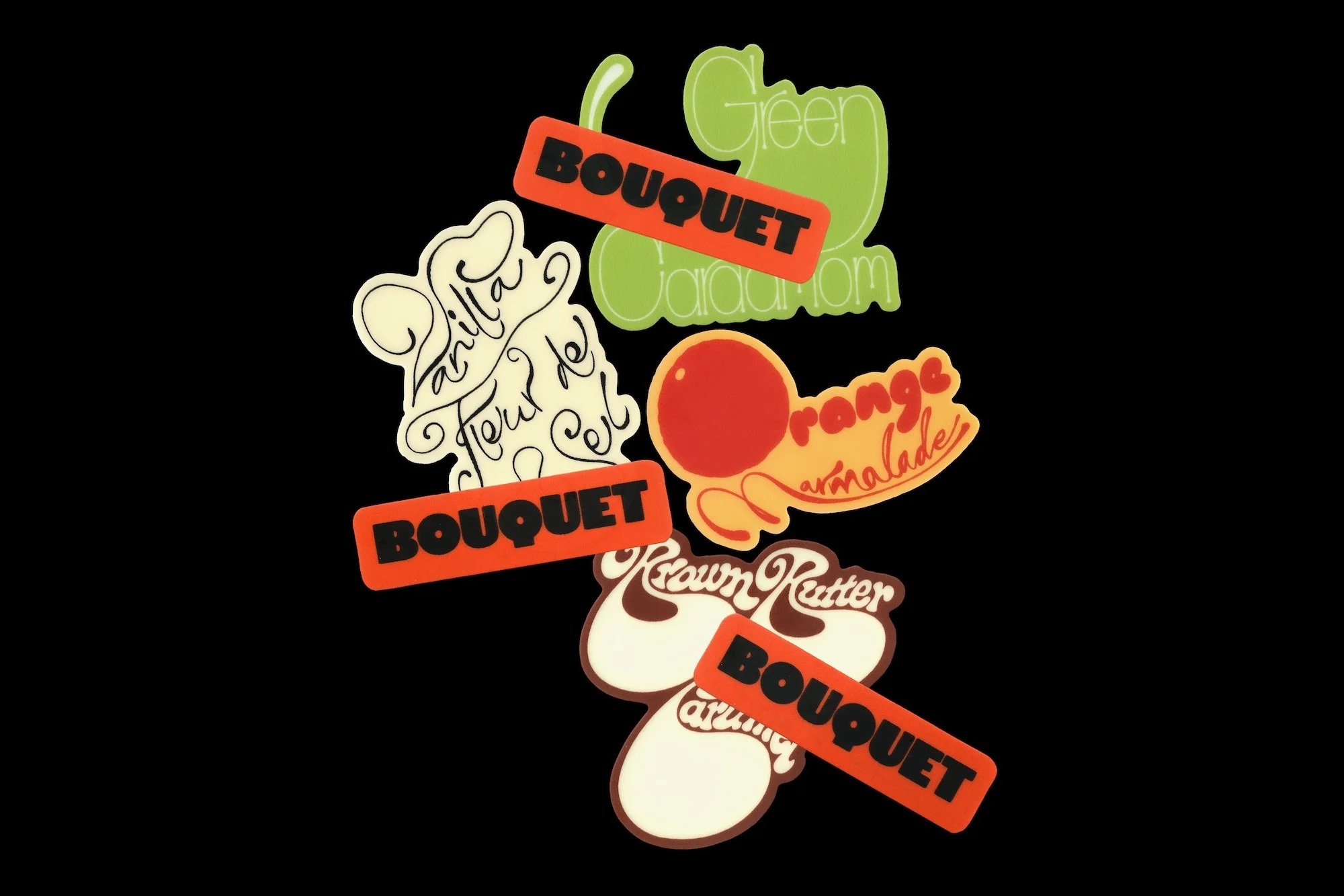Whimsical food labels in retro style on a black backdrop, featuring unique flavor names like Vanilla, Orange, and Brown Butter.