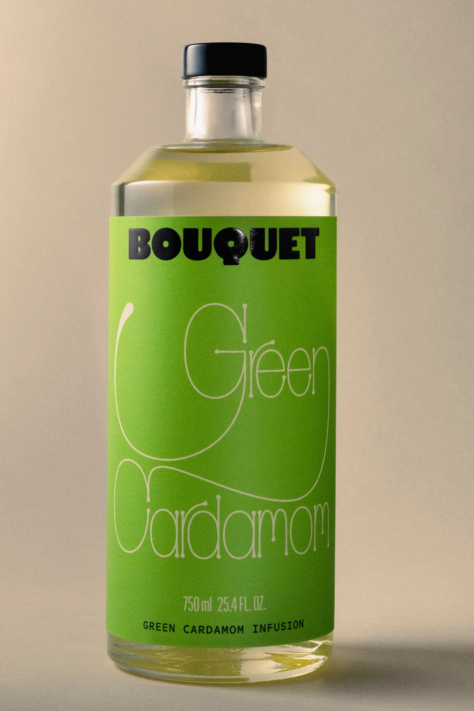 Bouquet Green Cardamom infusion in a clear glass bottle with a green label, featuring the brand name in bold black letters.