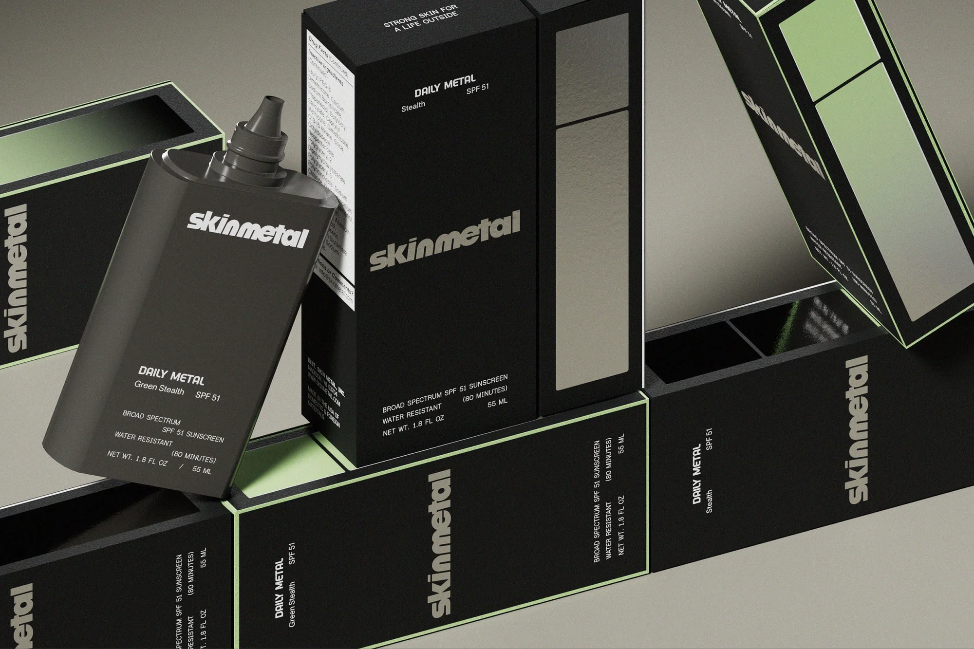 Skinmetal Daily Metal sunscreen products featuring SPF 50, presented in dark grey bottles and packaging on a light grey surface.