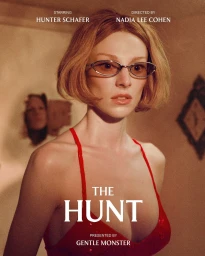 Hunter Schafer wearing silver sunglasses and a red sequin dress in a cinematic campaign portrait directed by Nadia Lee Cohen.