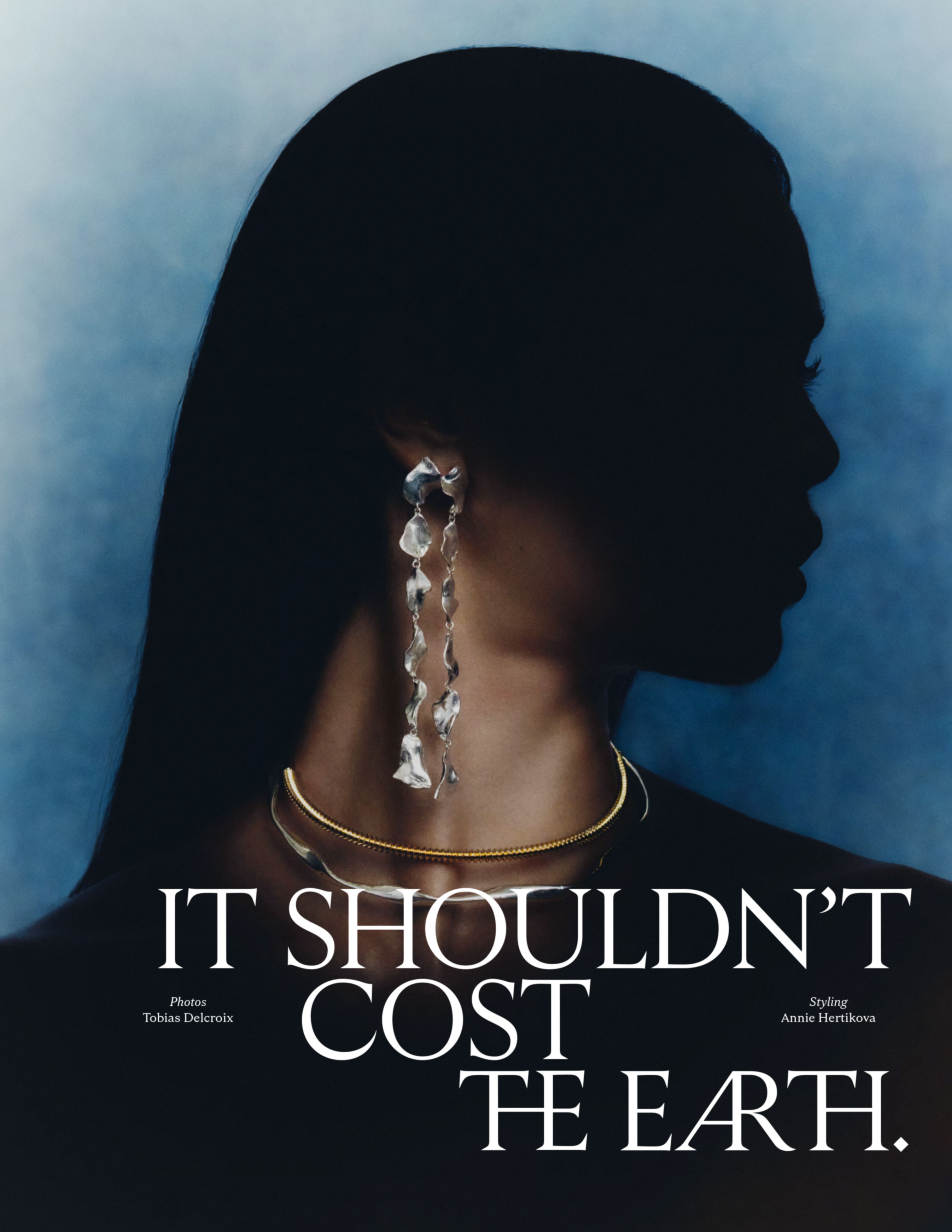 Fashion shot featuring woman's silhouette with jewelry on blue background, with text overlay 'It Shouldn't Cost The Earth'.