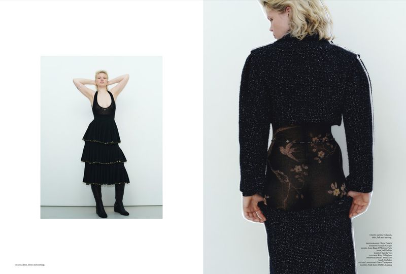 Editorial fashion shot featuring a blonde woman in a tiered black dress and boots, and back view of another model in a jacket and skirt.