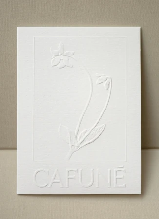 Embossed flower illustration on white paper with 'CAFUNE' text at the bottom, conveying a minimalist and textured botanical artwork.