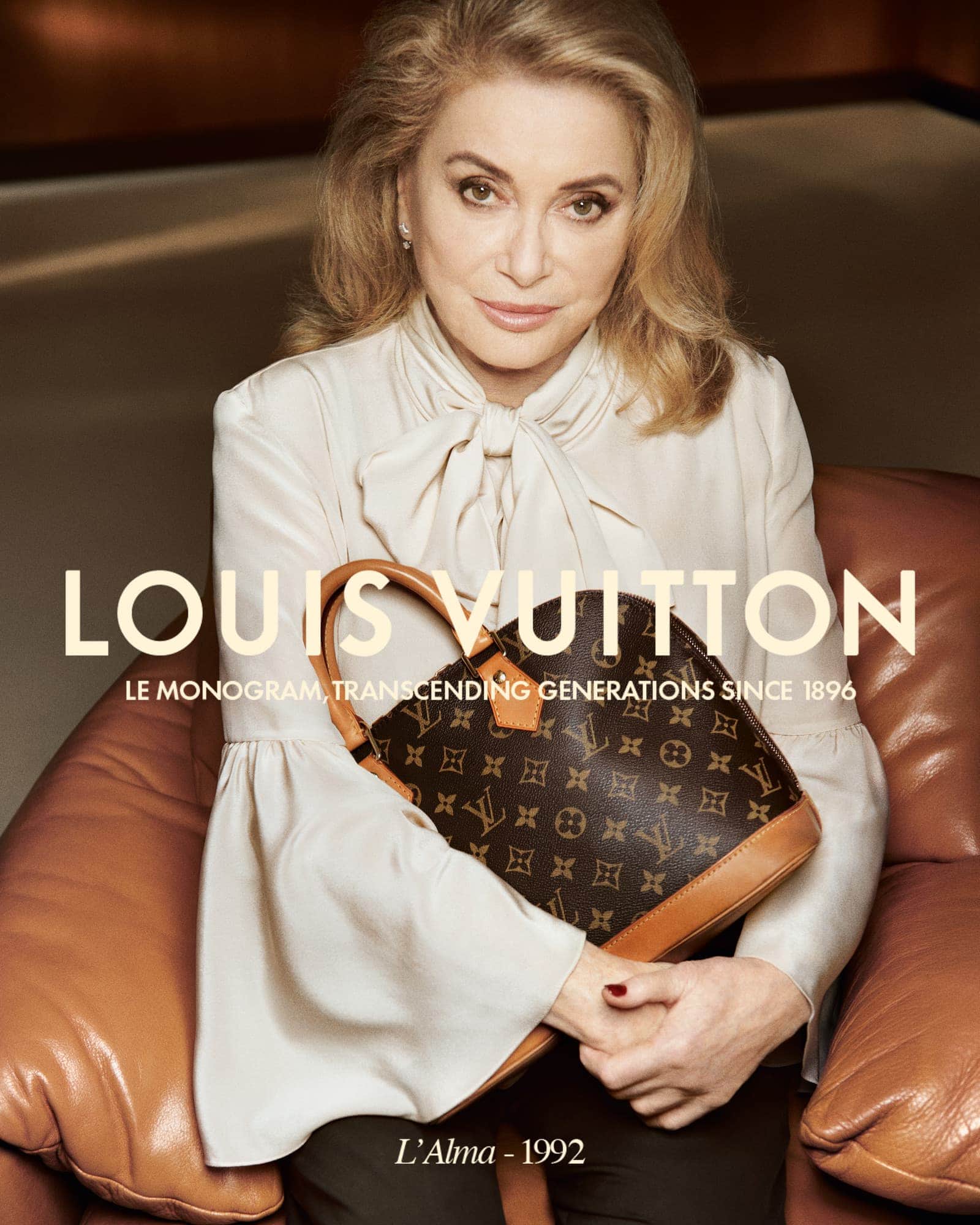 Elegant woman poses with a Louis Vuitton monogram bag in a fashion advertisement with studio lighting and a classic refined style.