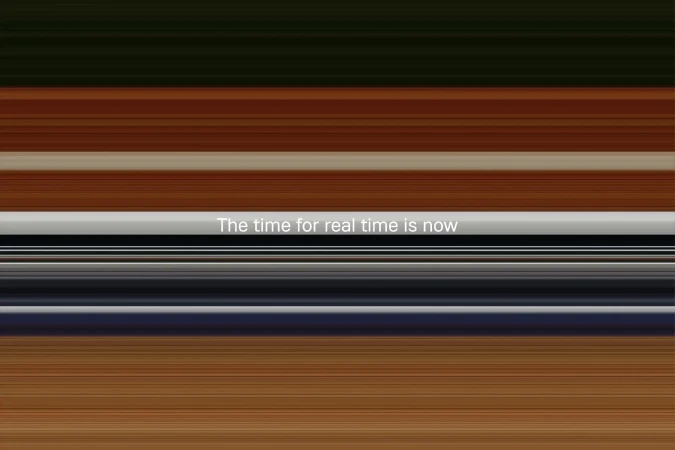 Abstract gradient background with horizontal bands of brown, white, gray, and black. White text overlay reads 'The time for real time is now'.