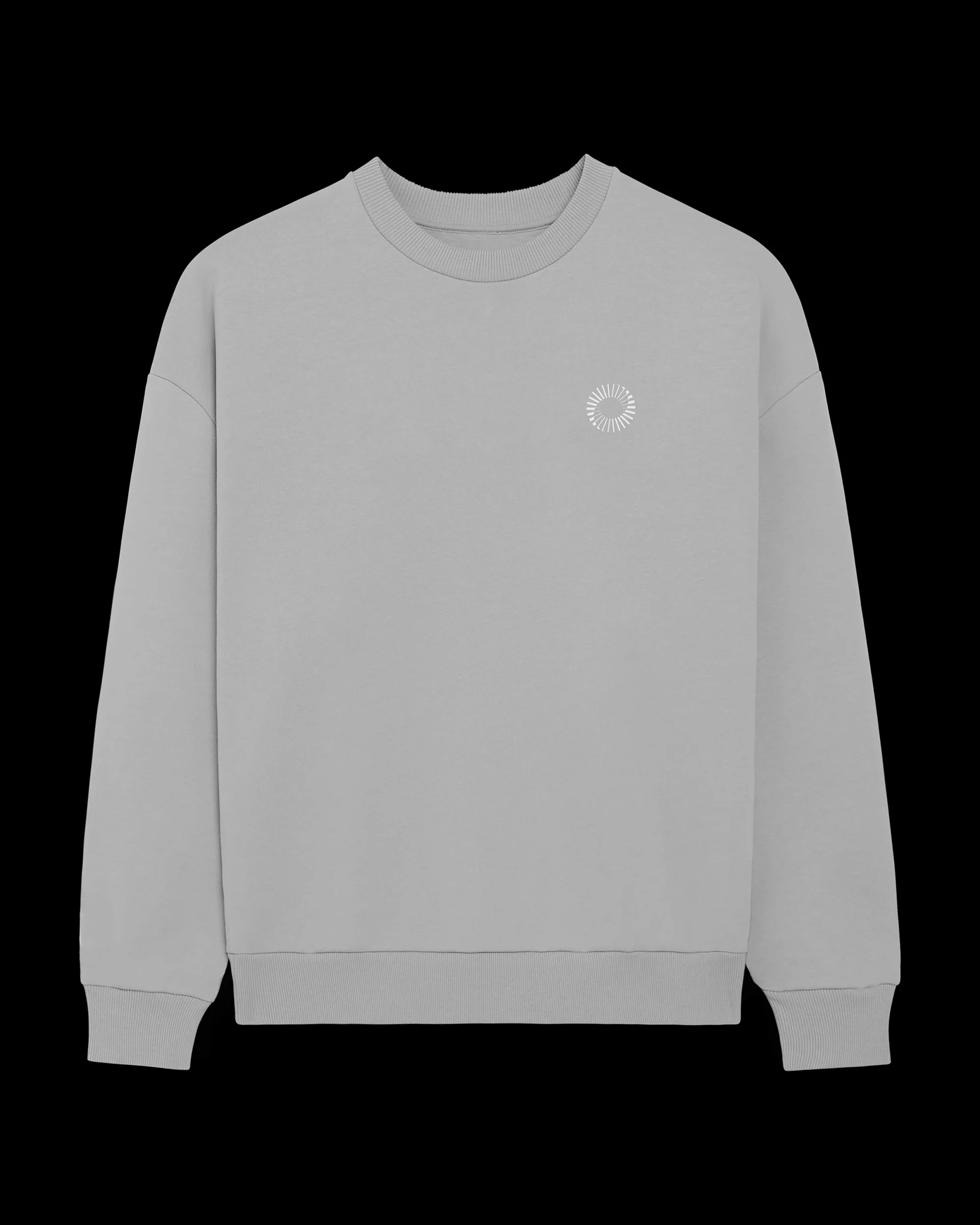 Grey long-sleeve shirt displayed on a black background, featuring a small white circular logo on the upper chest area.