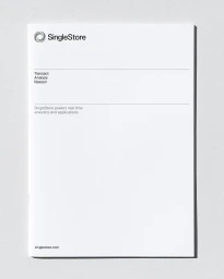 White brochure cover featuring the SingleStore logo and typography against a neutral textured surface