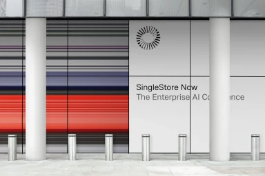 SingleStore Now branding displayed on a modern building exterior with vertical white columns and striped graphic panels.