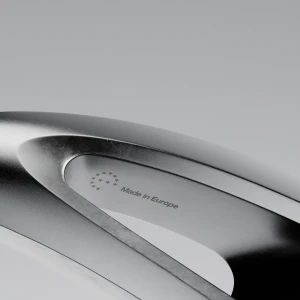 Close-up macro shot of a sleek metallic surface featuring engraved Made in Europe text and stars logo