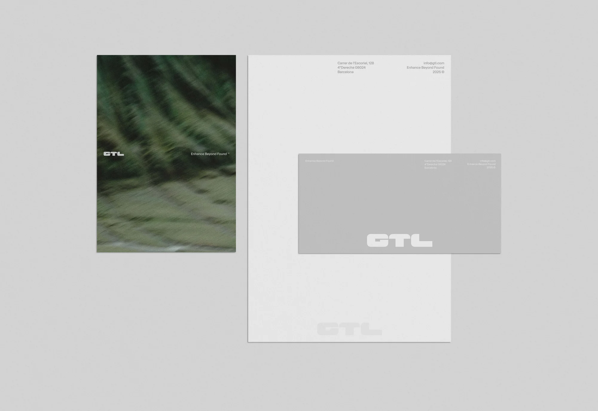 Letterhead, envelope, and brochure featuring the GTL logo in a minimalist design against a pale grey background.