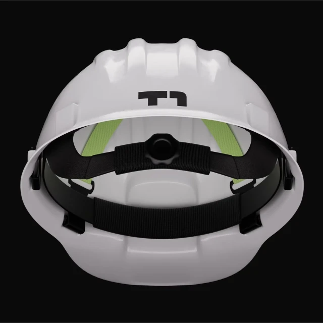 Image of a white hard hat with black adjustable head straps. The hard hat has a logo on the front and sits against a dark background.
