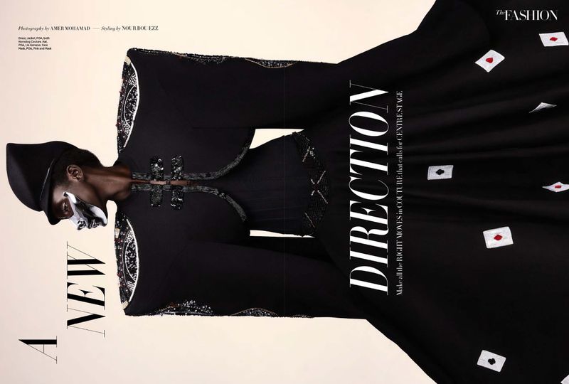 Editorial fashion shot showcases a black-clad model in couture with face paint against a neutral backdrop, emphasizing dramatic style.